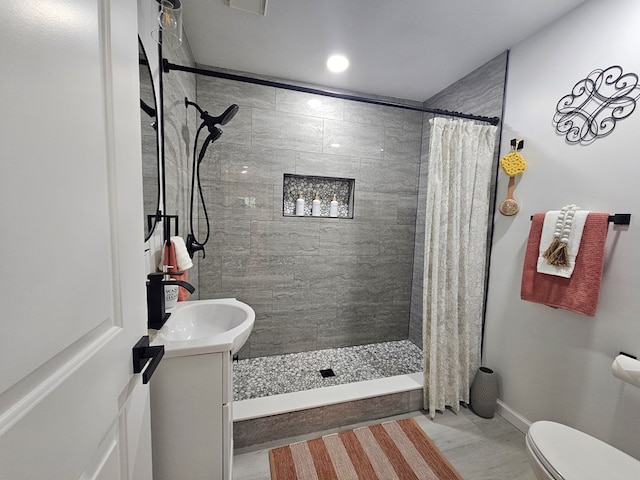 276 Fairview, Ozark, AL 36360 - bathroom with vanity, a tile shower, and recessed lighting