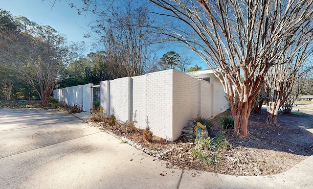 view of side of property with fence