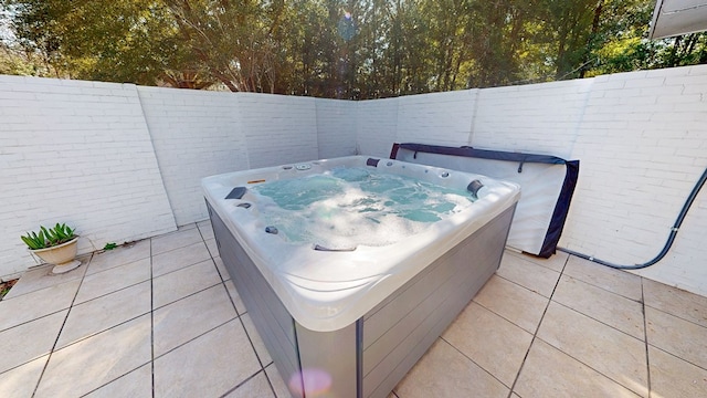 view of patio / terrace featuring a fenced backyard and an outdoor hot tub