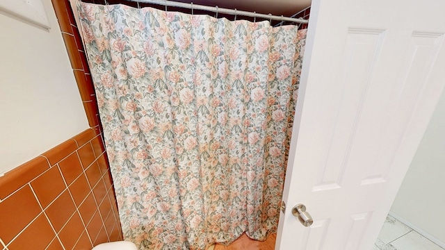 bathroom with a shower with shower curtain