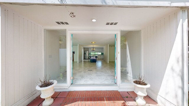 doorway to property featuring visible vents