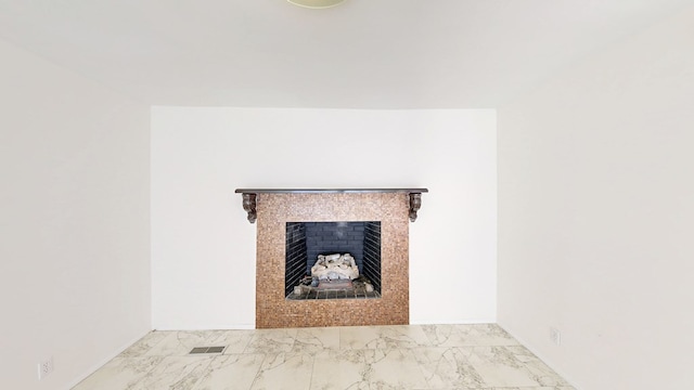 detailed view of a tile fireplace and baseboards