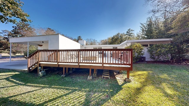 wooden terrace featuring a yard and stairway