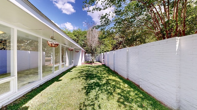 view of yard with a fenced backyard
