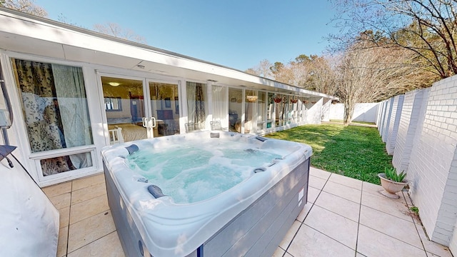 view of patio / terrace featuring a fenced backyard and a hot tub