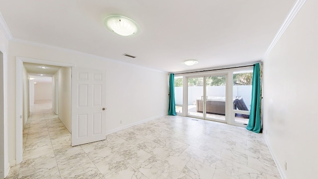 unfurnished room featuring marble finish floor, crown molding, baseboards, and visible vents