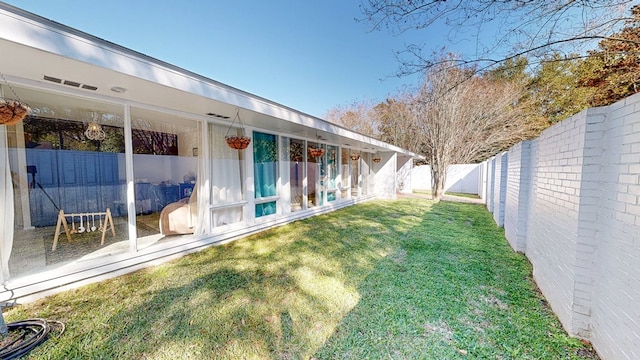 view of yard with a fenced backyard