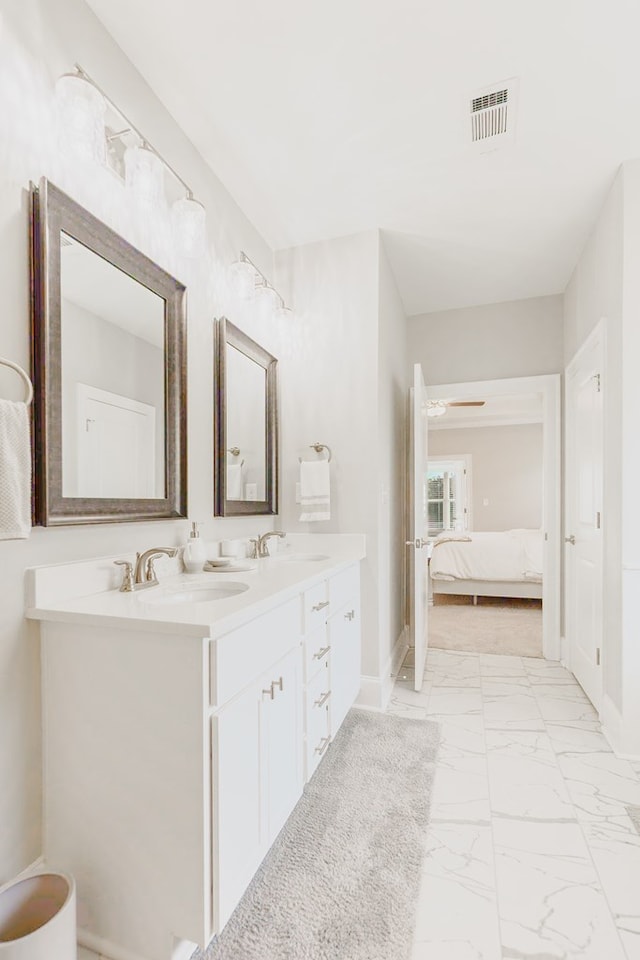 bathroom featuring ceiling fan and vanity