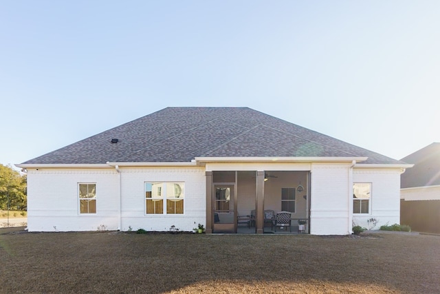 back of house with a yard and a patio