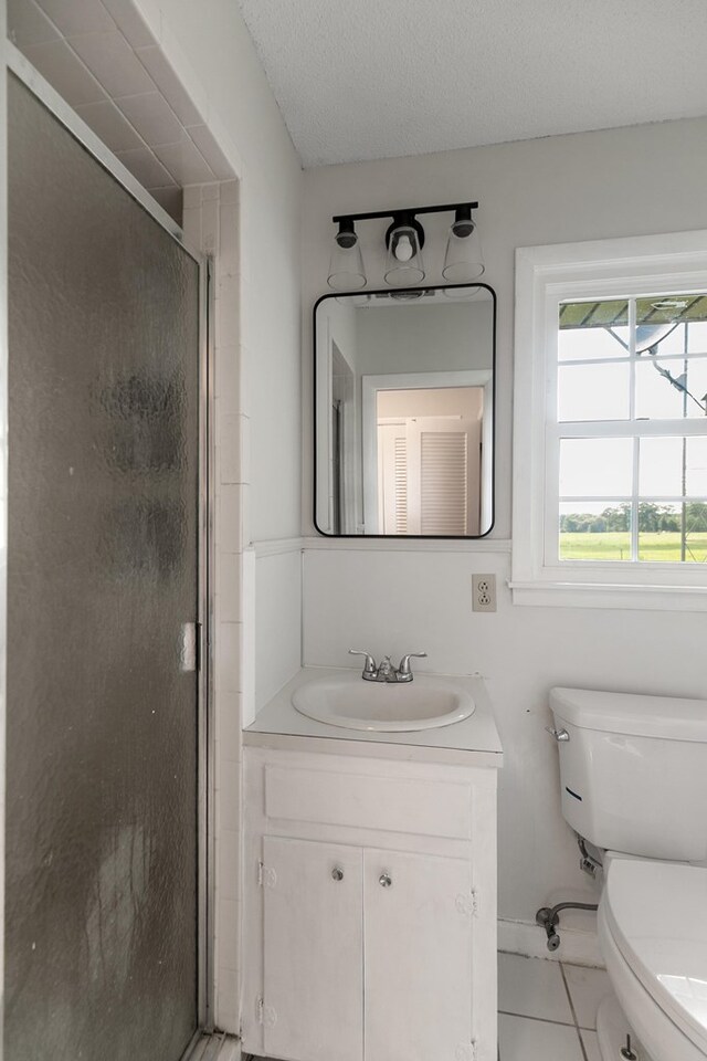 351 Hayborn Rd, Webb, AL 36376 - full bath featuring vanity, a stall shower, and tile patterned flooring