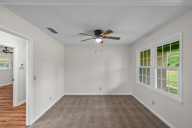 351 Hayborn Rd, Webb, AL 36376 - empty room with ceiling fan, a textured ceiling, and carpet flooring
