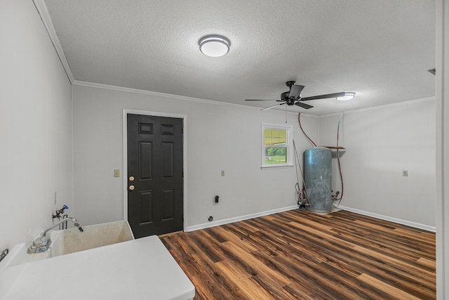 351 Hayborn Rd, Webb, AL 36376 - interior space with crown molding, a textured ceiling, a ceiling fan, and dark wood-style flooring