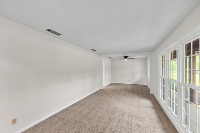 351 Hayborn Rd, Webb, AL 36376 - unfurnished room with carpet flooring, a ceiling fan, and a textured ceiling