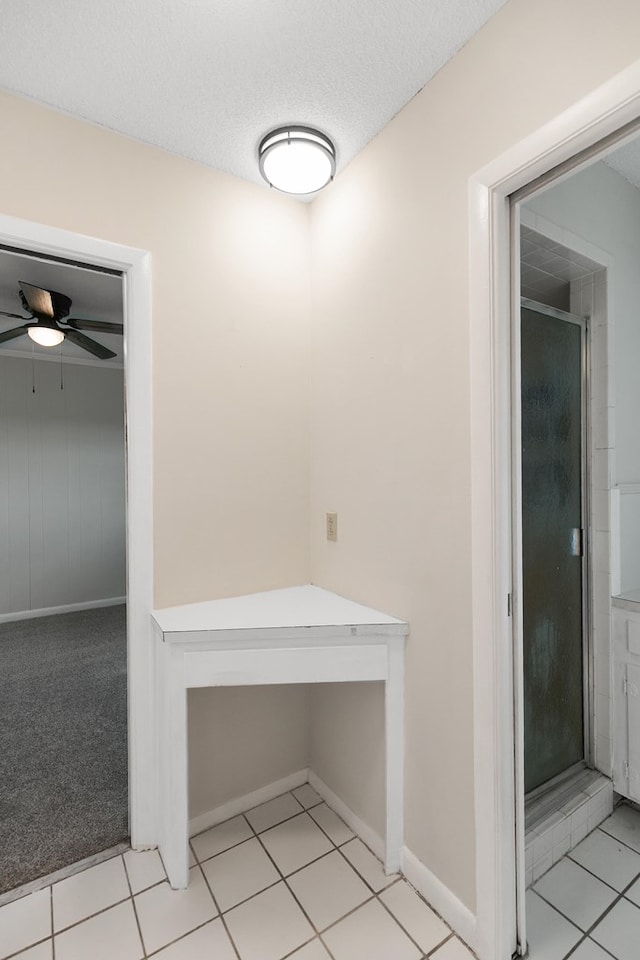 351 Hayborn Rd, Webb, AL 36376 - hallway with light tile patterned floors and a textured ceiling