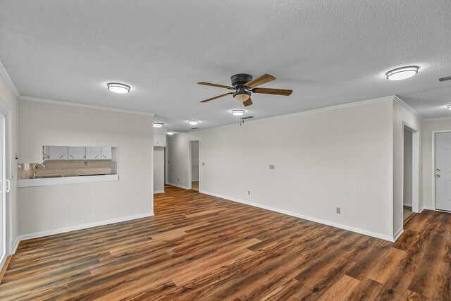 351 Hayborn Rd, Webb, AL 36376 - unfurnished living room featuring crown molding, wood finished floors, ceiling fan, and a textured ceiling