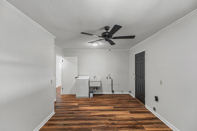 351 Hayborn Rd, Webb, AL 36376 - laundry room featuring ornamental molding, ceiling fan, dark wood finished floors, a textured ceiling, and a desk