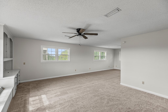 351 Hayborn Rd, Webb, AL 36376 - unfurnished living room featuring a ceiling fan, carpet flooring, and a textured ceiling