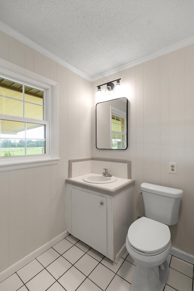 351 Hayborn Rd, Webb, AL 36376 - bathroom featuring ornamental molding, vanity, a textured ceiling, and tile patterned flooring