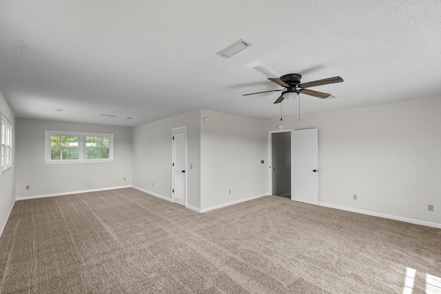 351 Hayborn Rd, Webb, AL 36376 - unfurnished room featuring carpet floors, a ceiling fan, and a textured ceiling