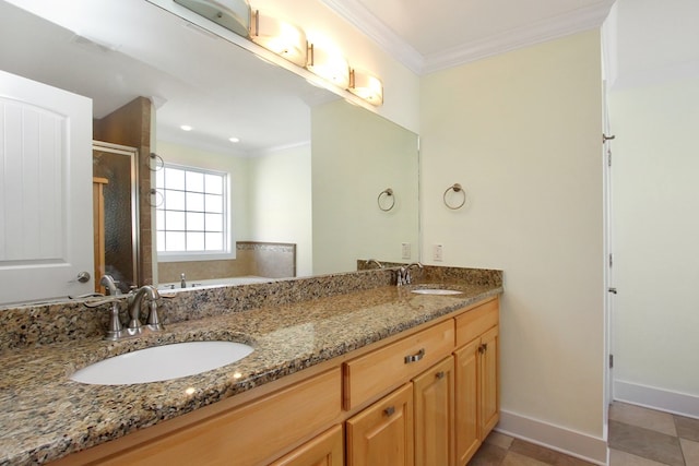 bathroom with ornamental molding, a sink, and a shower stall