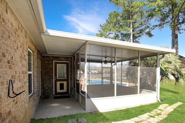 view of patio featuring a sunroom and a carport