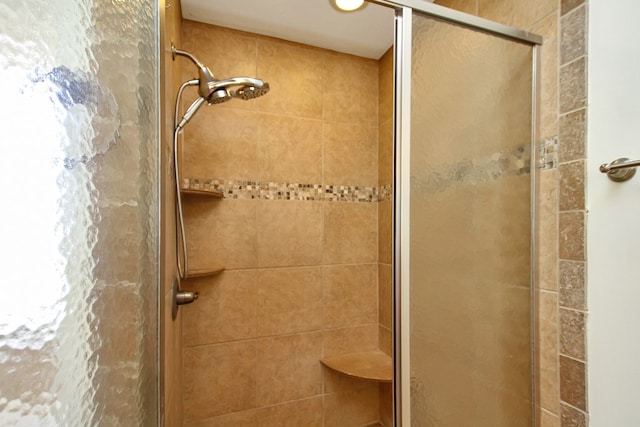 bathroom featuring a shower stall