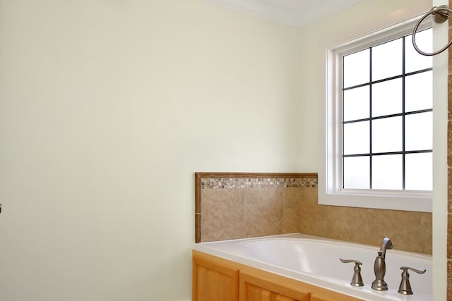 full bath featuring ornamental molding and a bath