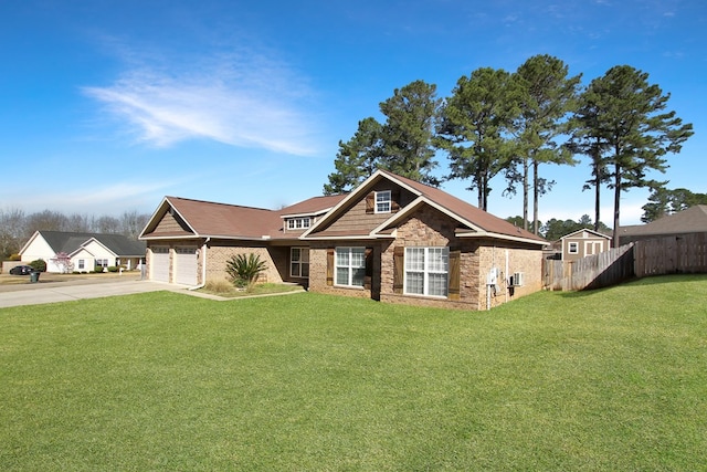 craftsman-style house with a garage, driveway, a front yard, and fence