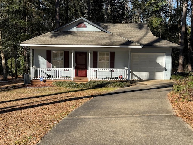 view of front of property with a porch and a garage