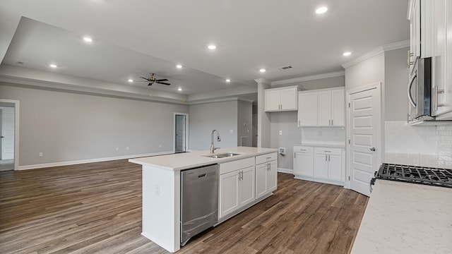 308 Heritage Way, Headland, AL 36345 - kitchen with dark wood-type flooring, a sink, white cabinetry, open floor plan, and appliances with stainless steel finishes