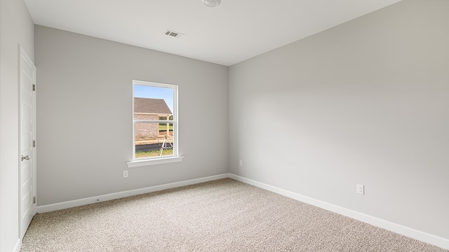 308 Heritage Way, Headland, AL 36345 - spare room featuring carpet floors, baseboards, and visible vents