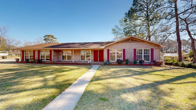 single story home featuring a front lawn and brick siding