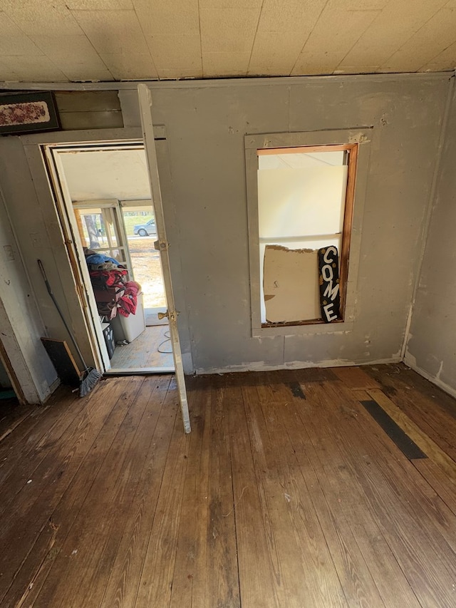 spare room with wood-type flooring