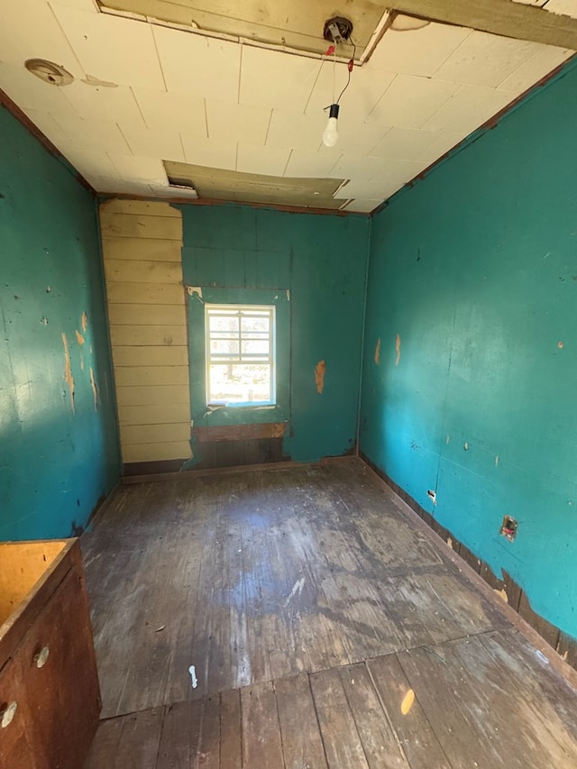 unfurnished room featuring dark hardwood / wood-style floors