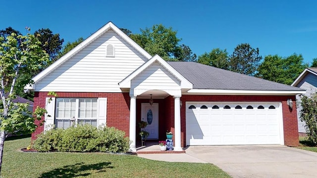 view of front of home with concrete driveway, brick siding, an attached garage, and a front yard