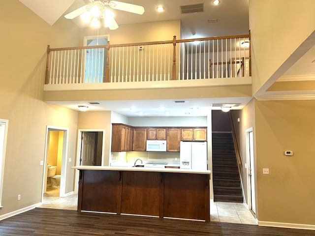 208 Planters Ct, Enterprise, AL 36330 - kitchen featuring white appliances, high vaulted ceiling, ceiling fan, light countertops, and light wood-style flooring