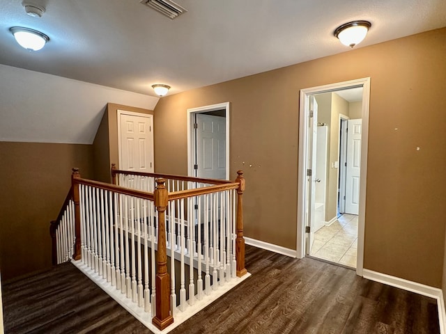 208 Planters Ct, Enterprise, AL 36330 - hall with wood finished floors, an upstairs landing, and vaulted ceiling