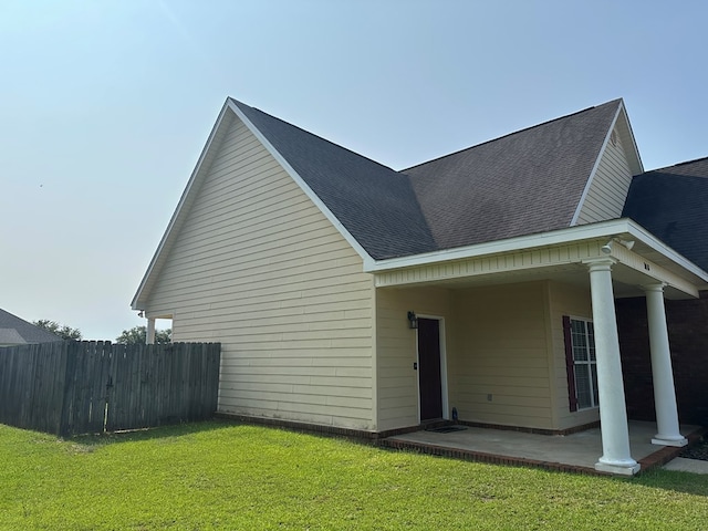 208 Planters Ct, Enterprise, AL 36330 - view of home's exterior with a shingled roof and a patio