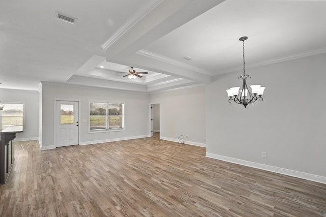 spare room featuring hardwood / wood-style flooring, crown molding, and ceiling fan with notable chandelier