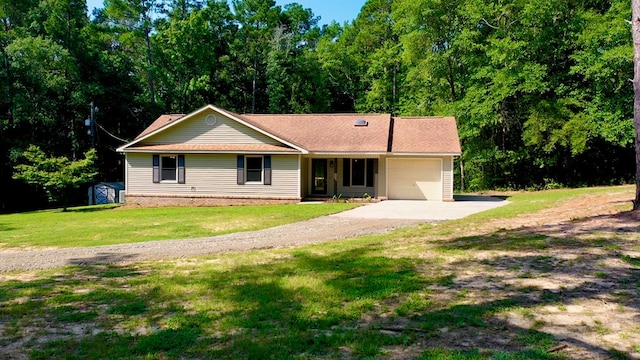 view of front of home with a front yard, a garage, and a storage unit