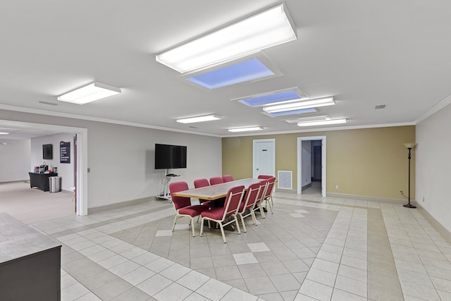 2054 John D Odom Rd, Dothan, AL 36303 - dining space featuring light tile patterned flooring, crown molding, and baseboards