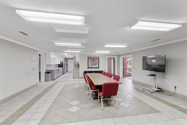2054 John D Odom Rd, Dothan, AL 36303 - dining area featuring light tile patterned floors, baseboards, and ornamental molding