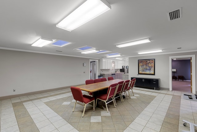2054 John D Odom Rd, Dothan, AL 36303 - dining room with light tile patterned floors, crown molding, and baseboards