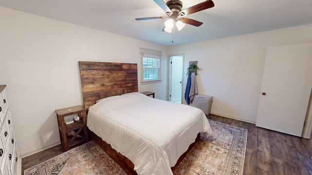 bedroom with ceiling fan, baseboards, and wood finished floors