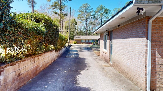 exterior space featuring brick siding