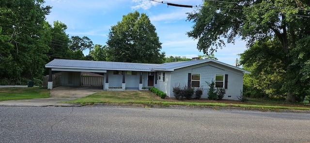 ranch-style house with a carport