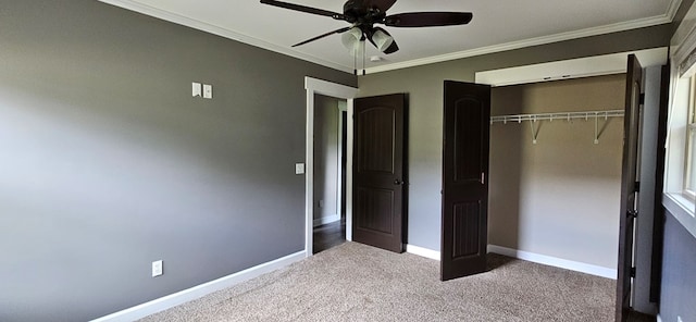 unfurnished bedroom featuring light carpet, ornamental molding, a closet, and ceiling fan