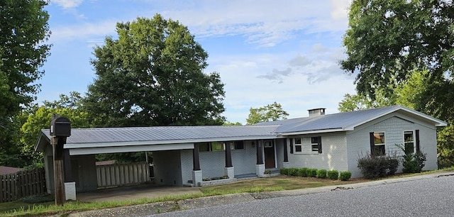 single story home featuring a carport