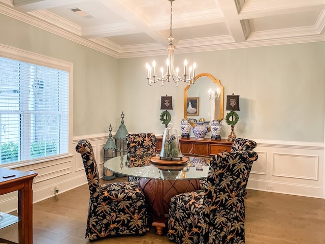 dining room with beam ceiling, wood finished floors, visible vents, and an inviting chandelier