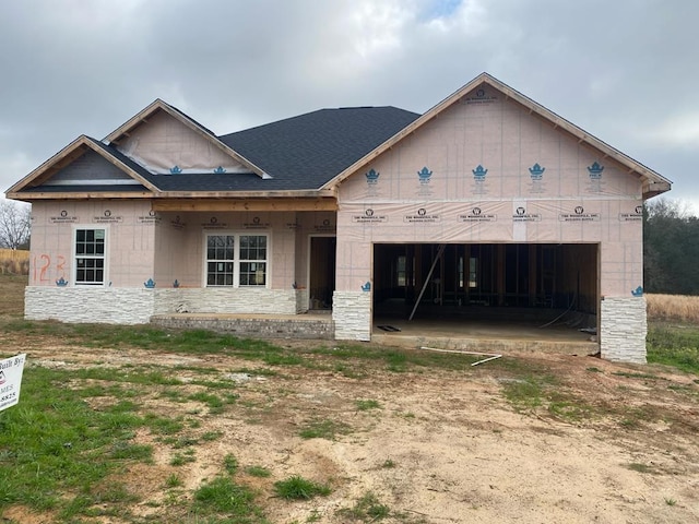 unfinished property with a garage